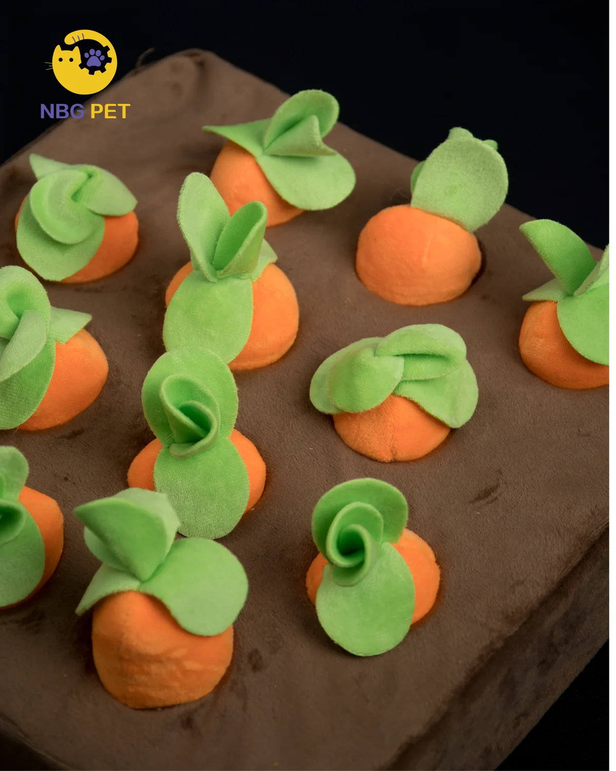 Close view of removable plush carrots in the enrichment mat